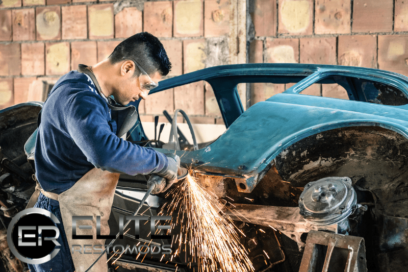 Picture of a person dissembling a classic car